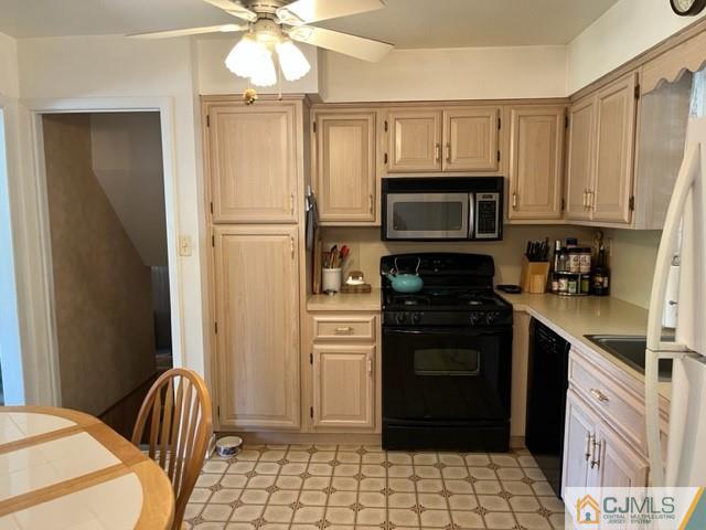 730 Lawrence Road Bound Brook, NJ 08805 - Photo 4 of 23 a kitchen with granite countertop a refrigerator stove and microwave