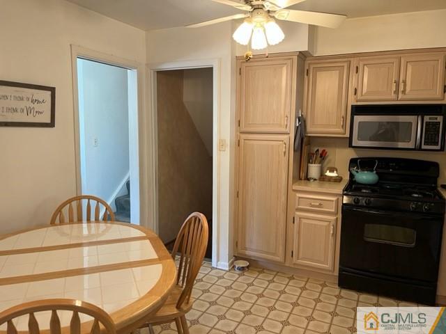 730 Lawrence Road Bound Brook, NJ 08805 - Photo 5 of 23 a kitchen with stainless steel appliances granite countertop a refrigerator a stove a microwave and island