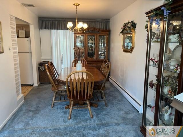 730 Lawrence Road Bound Brook, NJ 08805 - Photo 8 of 23 a view of a dining room with furniture and chandelier