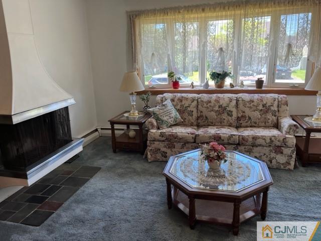 730 Lawrence Road Bound Brook, NJ 08805 - Photo 10 of 23 a living room with furniture and a fireplace