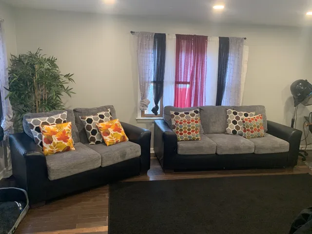 a living room with furniture and a window