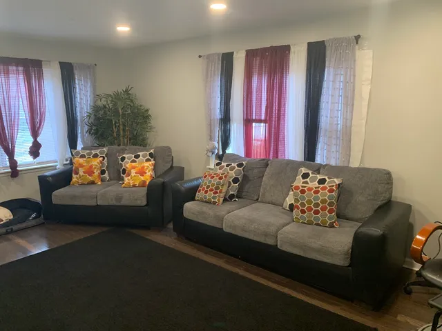 a living room with furniture and a window