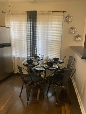 a view of a dining room with furniture