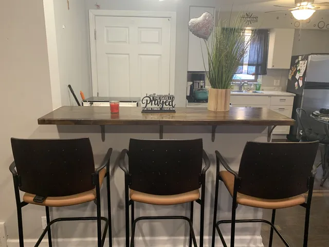 a dining room with chairs and a table