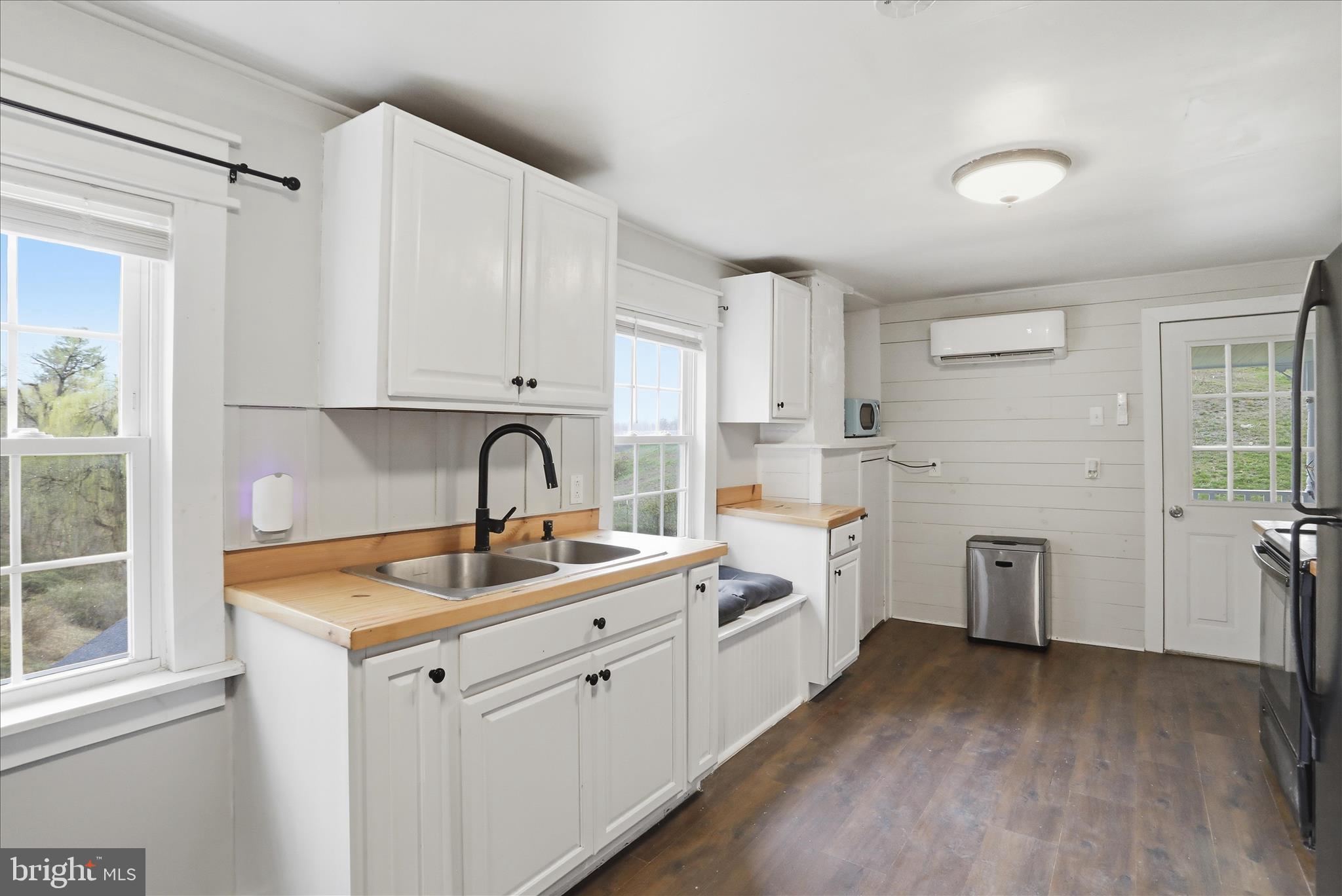 277 Bowmans Ridge Lane Burlington, WV 26710 - Photo 7 of 42 a kitchen with white cabinets and sink