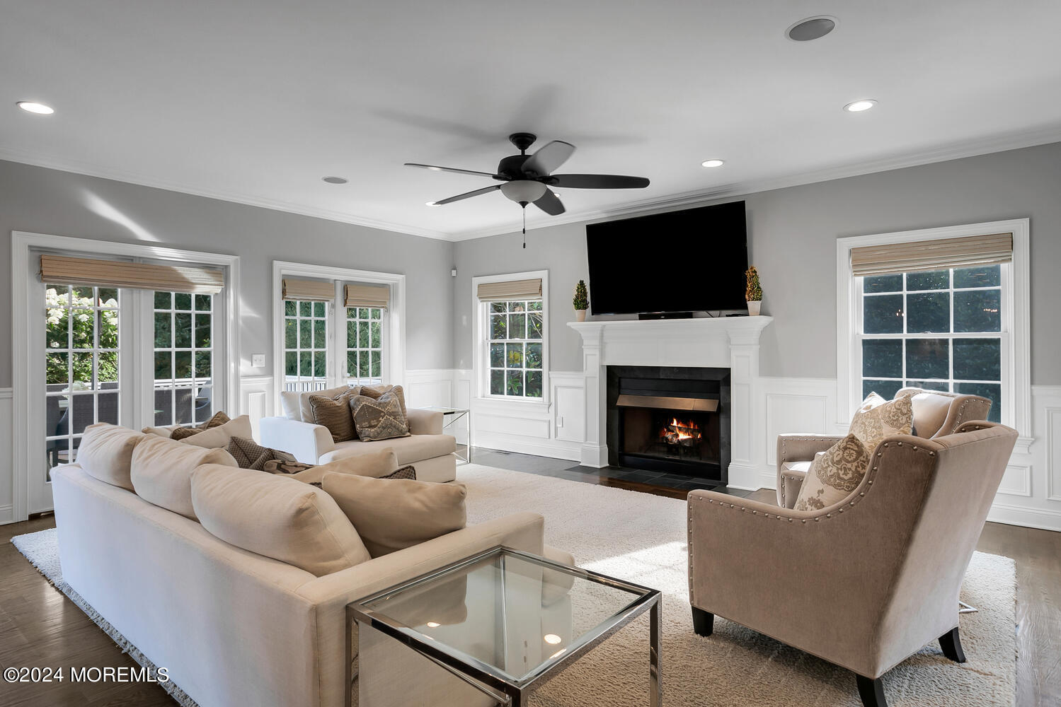 19 Old Phalanx Road Lincroft, NJ 07738 - Photo 12 of 68 a living room with furniture a flat screen tv and a fireplace