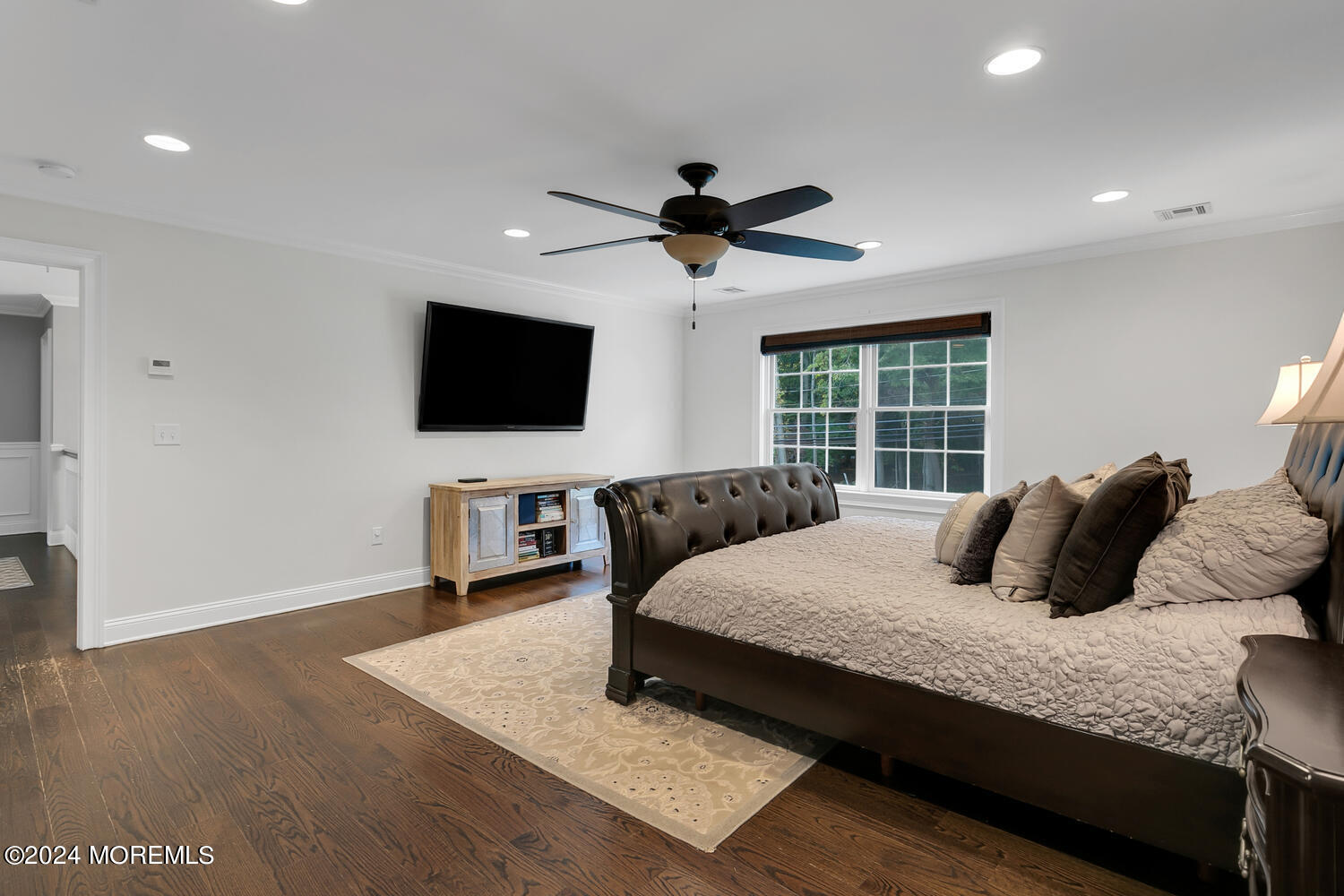 19 Old Phalanx Road Lincroft, NJ 07738 - Photo 27 of 68 a bedroom with a bed and a flat screen tv