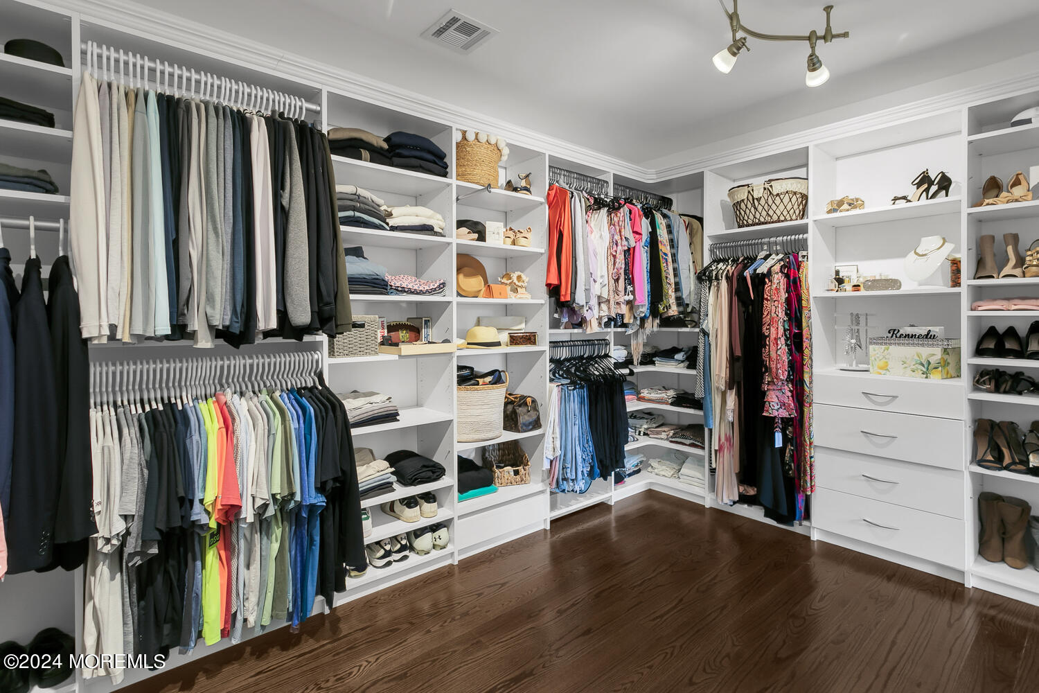 19 Old Phalanx Road Lincroft, NJ 07738 - Photo 28 of 68 a view of walk in closet with clothes and shoes