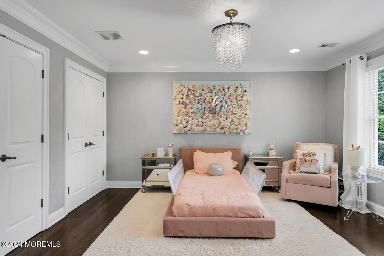 19 Old Phalanx Road Lincroft, NJ 07738 - Photo 35 of 68 a bedroom with a bed and a chandelier