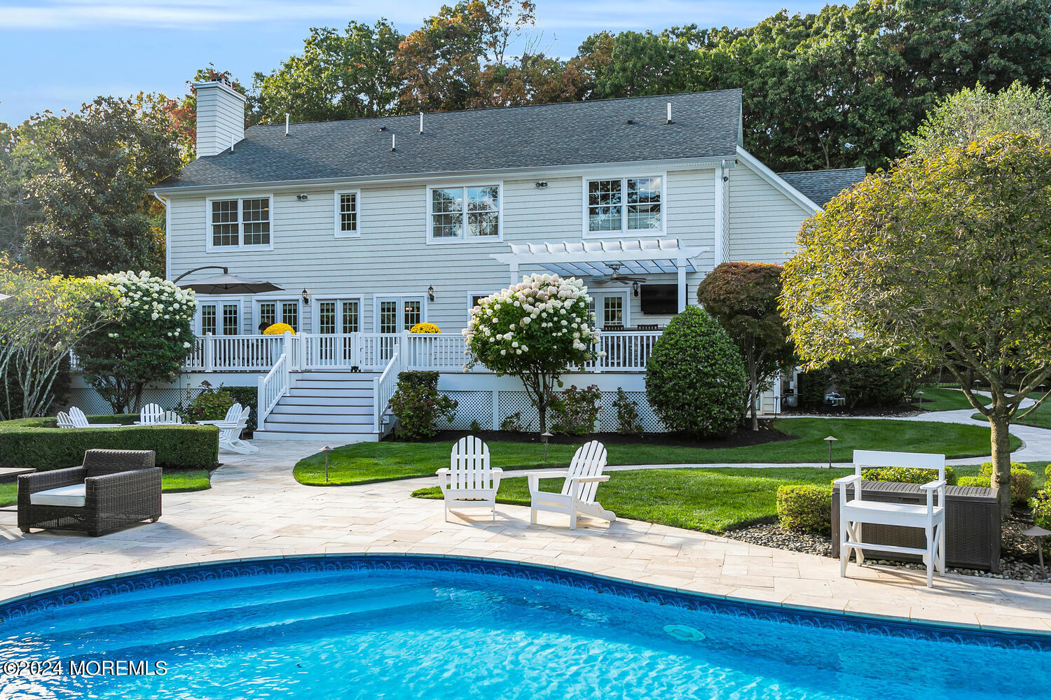 19 Old Phalanx Road Lincroft, NJ 07738 - Photo 55 of 68 a front view of a house with a yard table and chairs