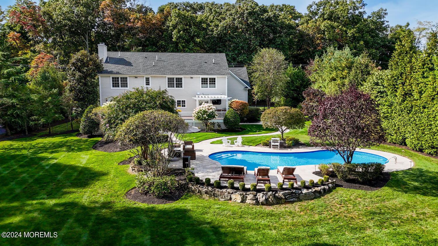 19 Old Phalanx Road Lincroft, NJ 07738 - Photo 56 of 68 a view of a house with a yard and sitting area