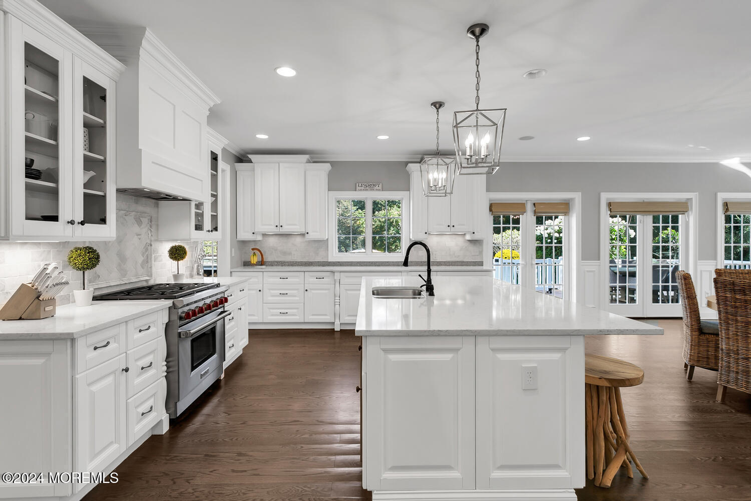 19 Old Phalanx Road Lincroft, NJ 07738 - Photo 8 of 68 a kitchen with stainless steel appliances granite countertop a sink dishwasher a stove and white cabinets with wooden floor