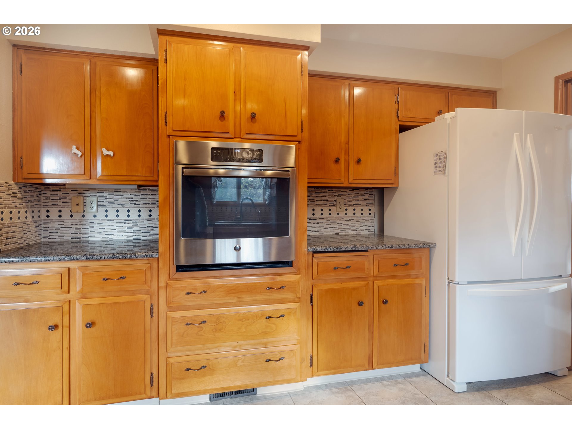 4290 Ivory Way Northeast Salem, OR 97305 - Photo 16 of 42 a kitchen with stainless steel appliances granite countertop a refrigerator and a stove