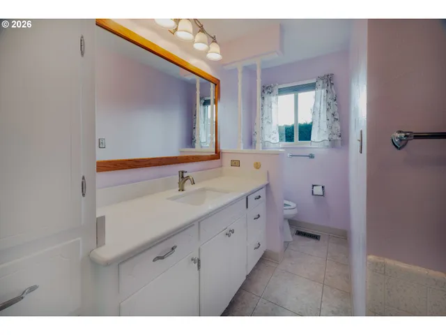a bathroom with a bathtub and a sink