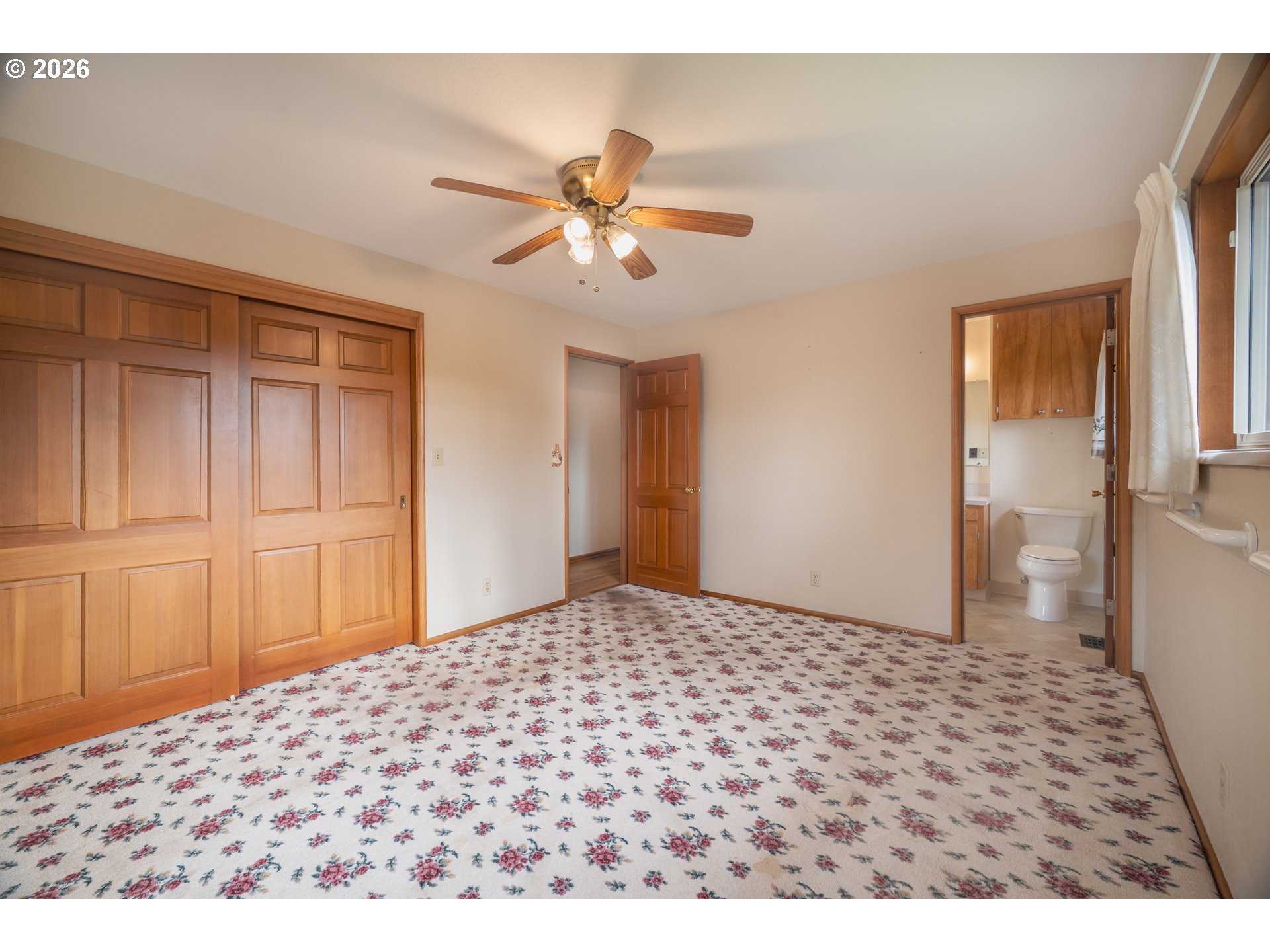 4290 Ivory Way Northeast Salem, OR 97305 - Photo 31 of 42 a bedroom with a bed and a chandelier