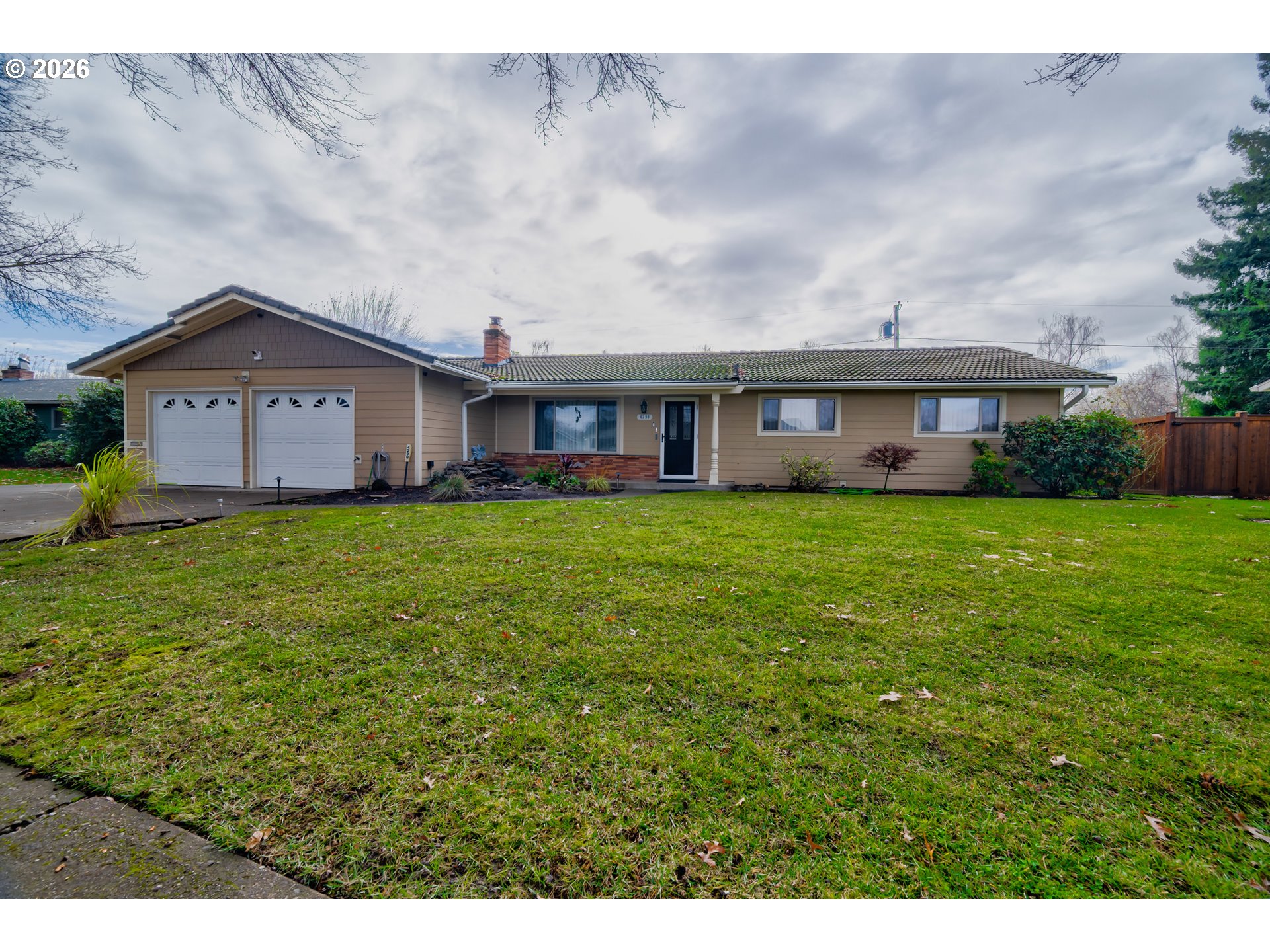4290 Ivory Way Northeast Salem, OR 97305 - Photo 34 of 42 a view of a house with a big yard and large trees