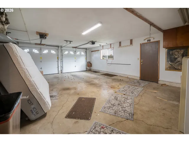 a view of a house with a small yard and plants