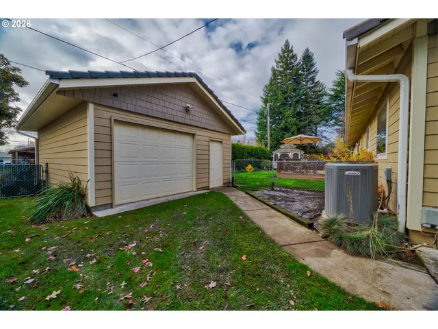 a view of a house with a yard and deck
