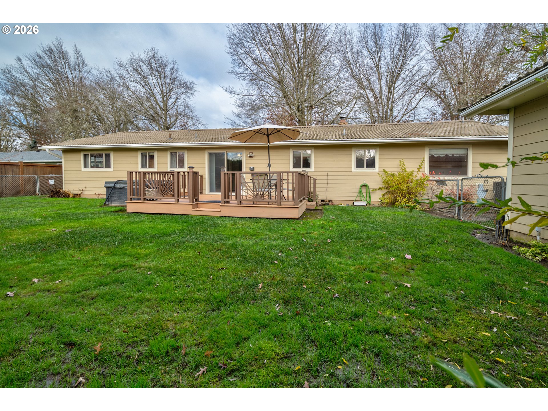 4290 Ivory Way Northeast Salem, OR 97305 - Photo 40 of 42 a front view of a house with a garden and trees