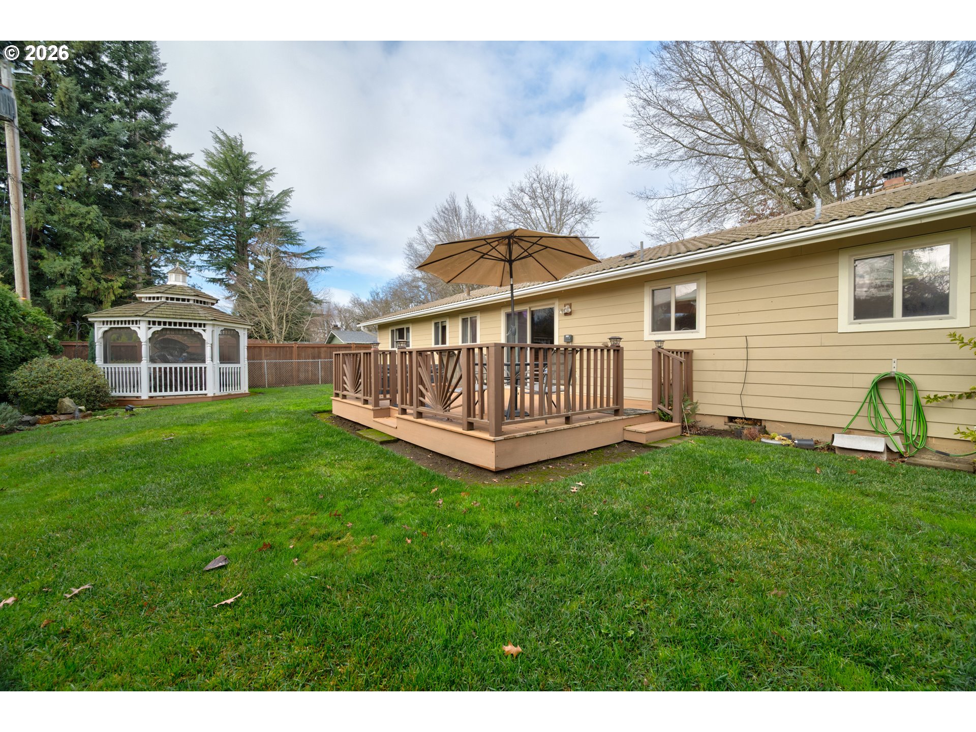 4290 Ivory Way Northeast Salem, OR 97305 - Photo 41 of 42 a view of a house with a yard and deck