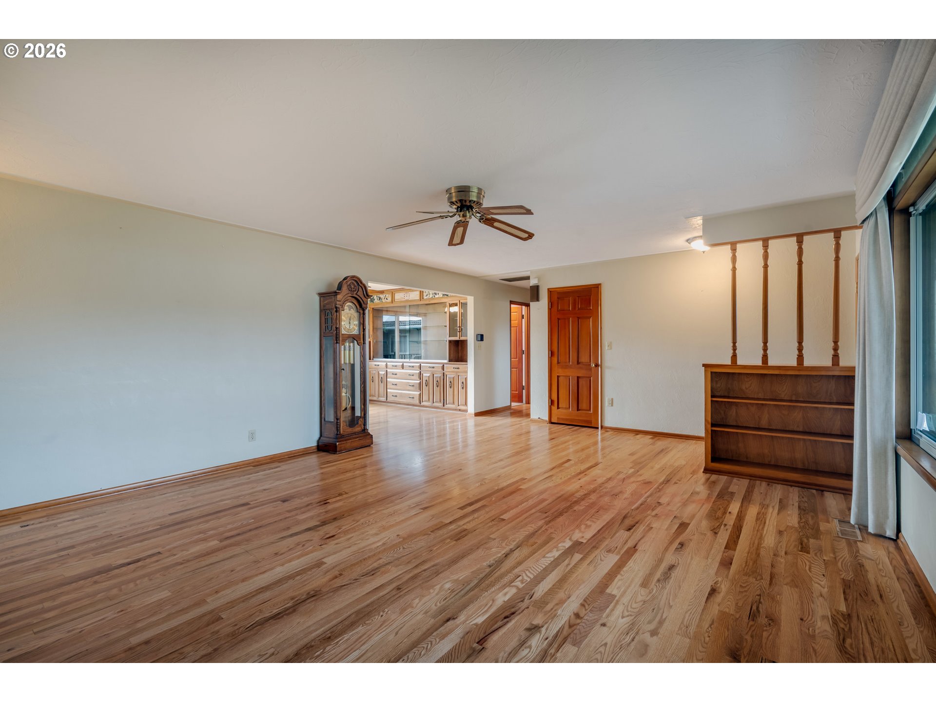 4290 Ivory Way Northeast Salem, OR 97305 - Photo 10 of 42 a view of empty room with wooden floor and fan
