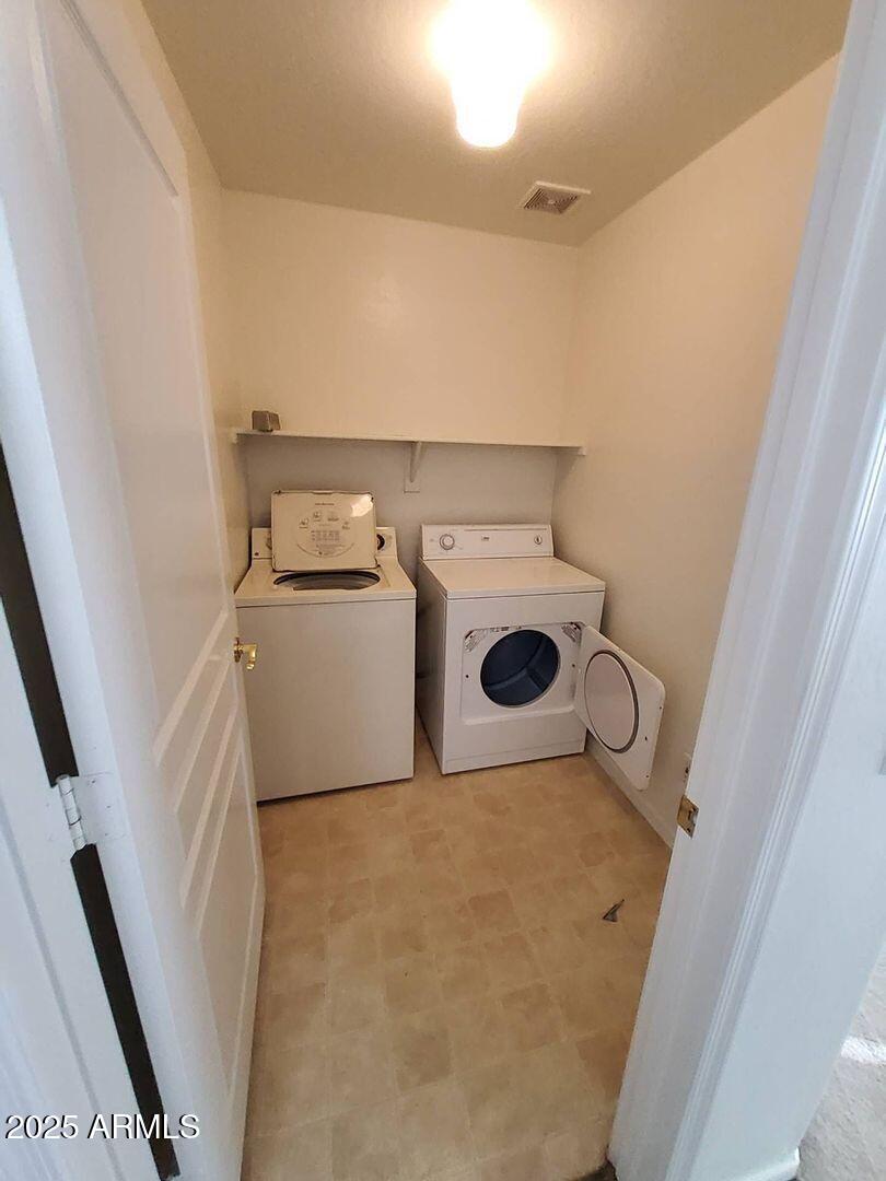 4335 West Carson Road Laveen, AZ 85339 - Photo 11 of 12 a utility room with dryer and washer