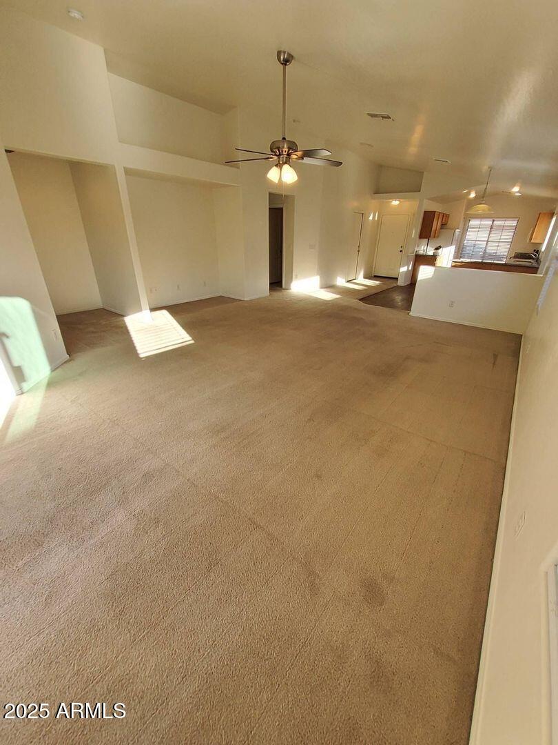 4335 West Carson Road Laveen, AZ 85339 - Photo 2 of 12 a view of a room with projector and furniture