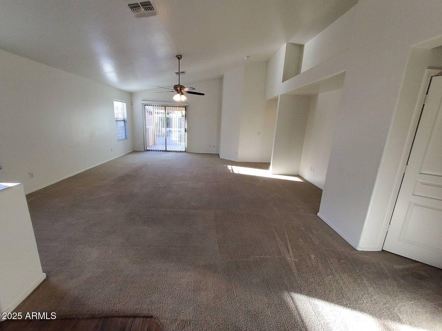 4335 West Carson Road Laveen, AZ 85339 - Photo 5 of 12 a view of a hallway with a chandelier