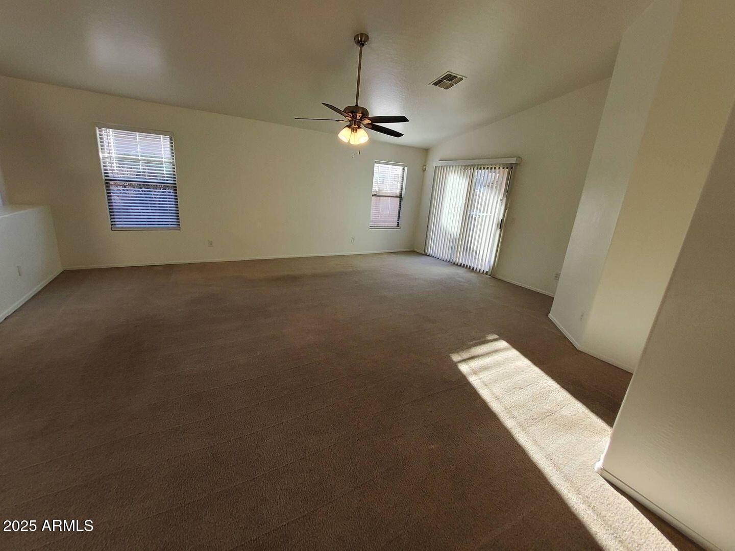 4335 West Carson Road Laveen, AZ 85339 - Photo 6 of 12 a view of an empty room with a window