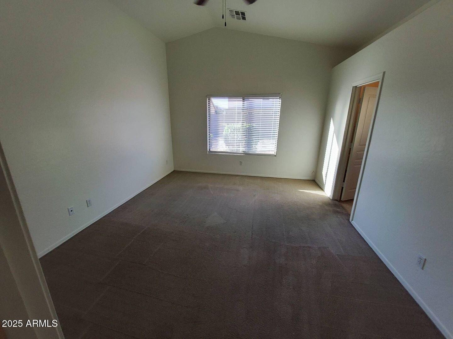 4335 West Carson Road Laveen, AZ 85339 - Photo 8 of 12 an empty room with windows