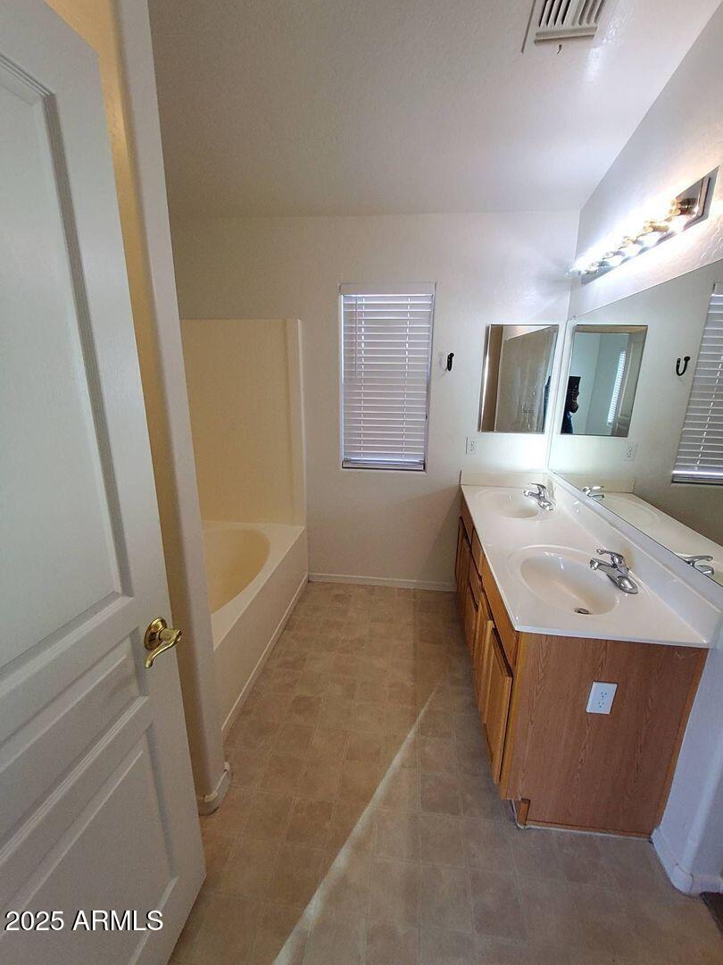 4335 West Carson Road Laveen, AZ 85339 - Photo 10 of 12 a utility room with dryer and washer