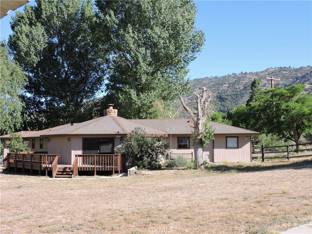26931 Columbia Way Tehachapi, CA 93561 - Photo 14 of 49 Back view of the home showcases the unique design and wonderful deck! Beautiful views all around this property.