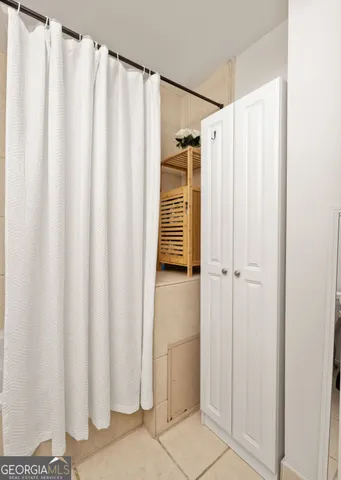 a bathroom with a shower and a tub
