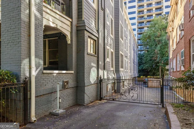 a view of a brick house with many windows