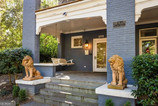 a view of a house with outdoor seating space