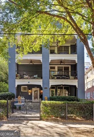 a front view of a building with garden