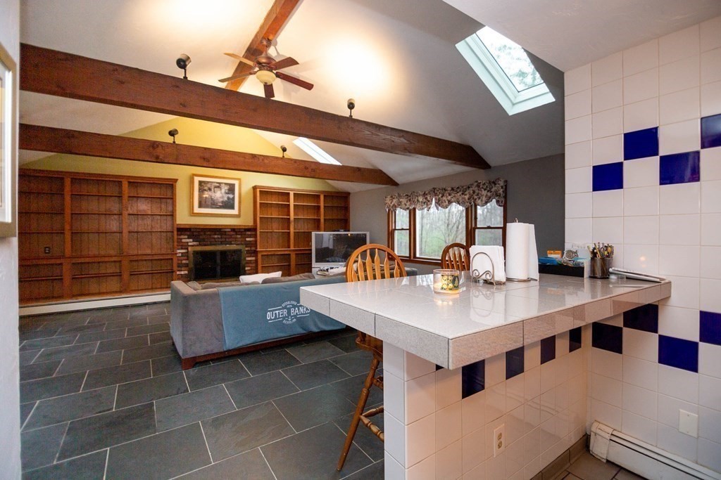114 Leslie Road Rowley, MA 01969 - Photo 17 of 42 a large kitchen with a counter space a sink appliances and cabinets