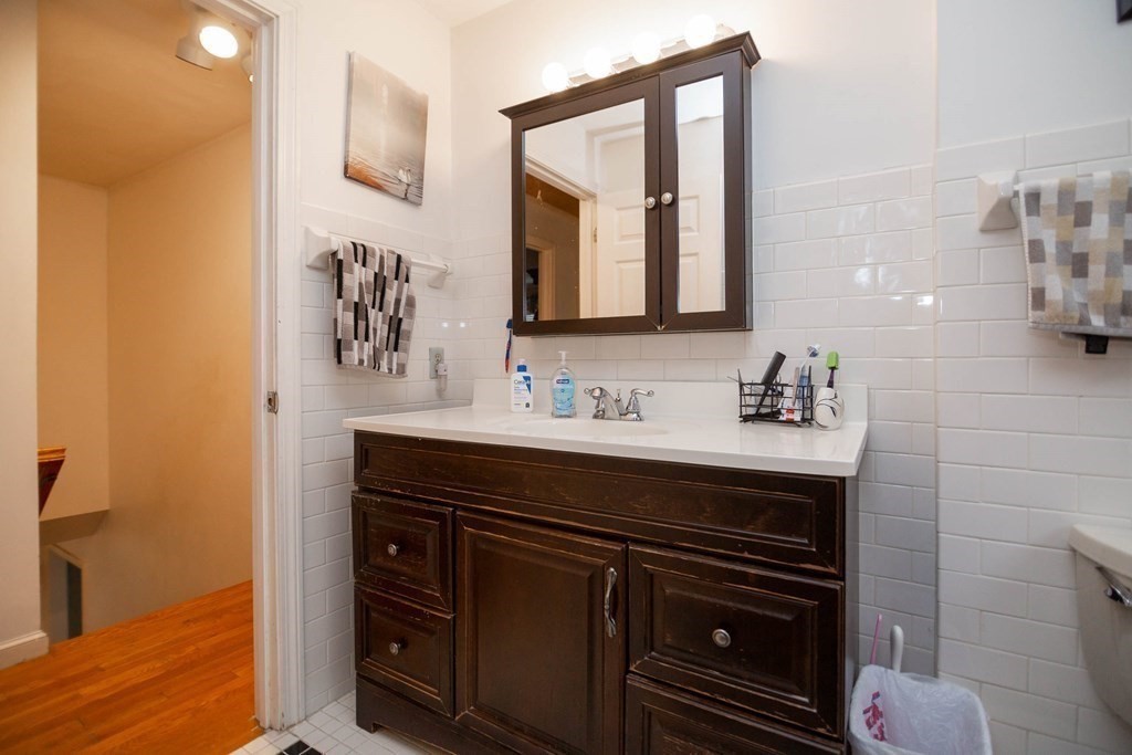 114 Leslie Road Rowley, MA 01969 - Photo 22 of 42 a bathroom with a sink vanity and a mirror