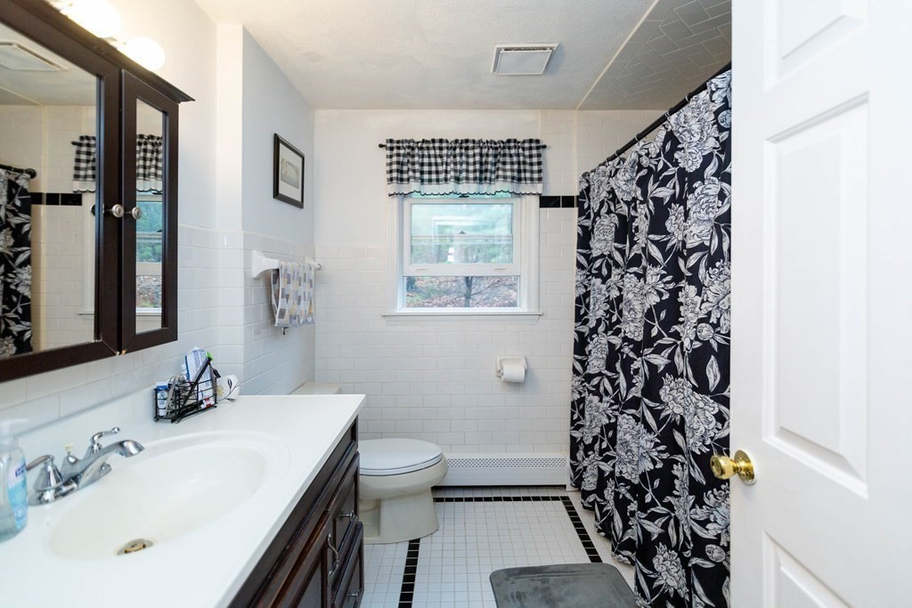114 Leslie Road Rowley, MA 01969 - Photo 23 of 42 a bathroom with a sink toilet and shower