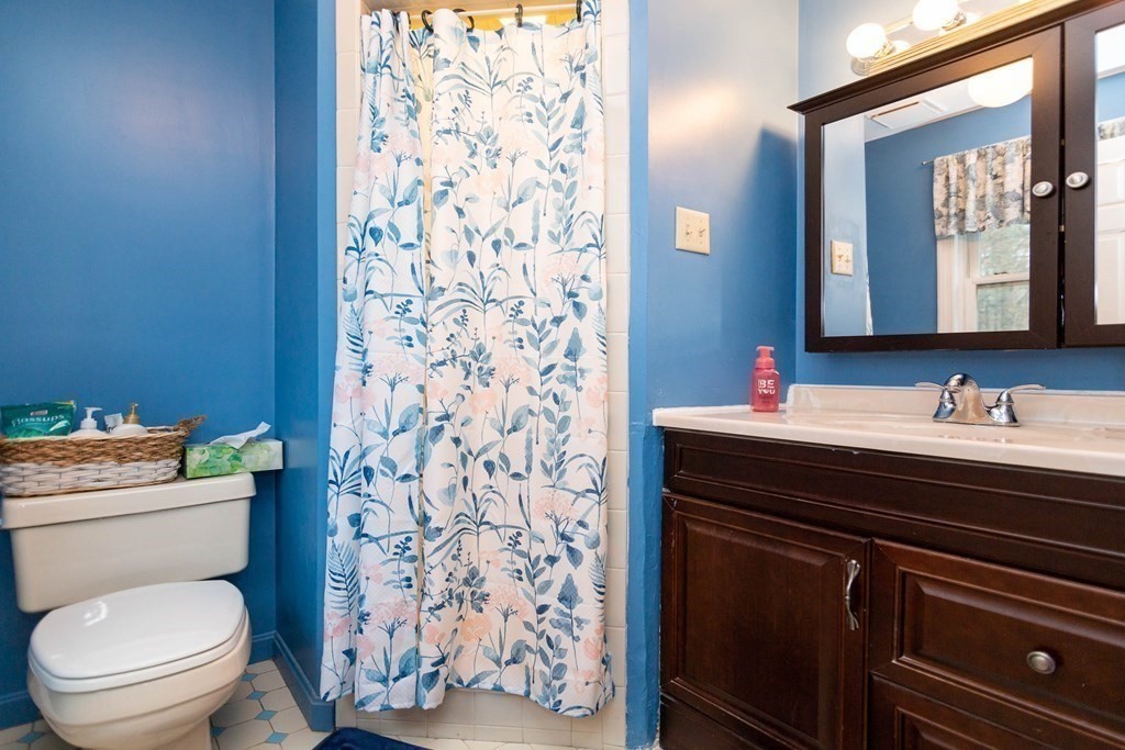 114 Leslie Road Rowley, MA 01969 - Photo 27 of 42 a bathroom with a granite countertop sink and a toilet