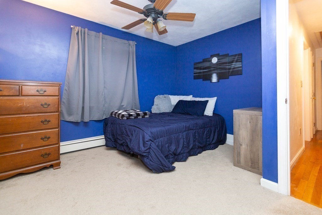 114 Leslie Road Rowley, MA 01969 - Photo 30 of 42 a bedroom with a bed and a dresser