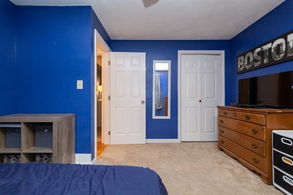 114 Leslie Road Rowley, MA 01969 - Photo 31 of 42 a view of room with wooden floor and flat screen tv