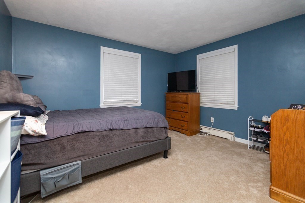 114 Leslie Road Rowley, MA 01969 - Photo 32 of 42 a bedroom with a bed and dresser