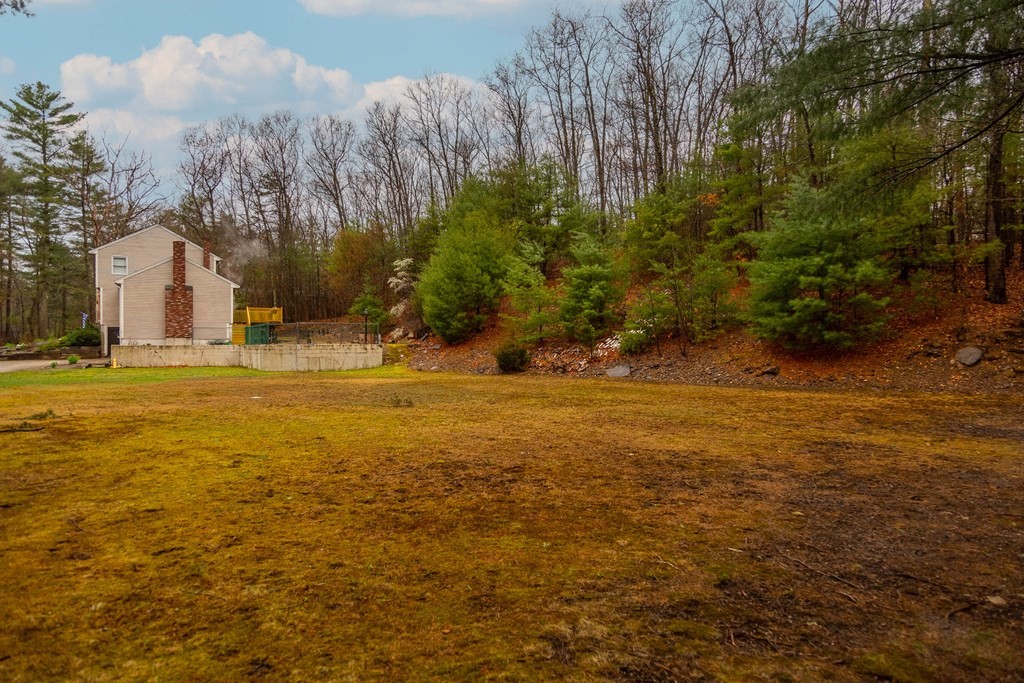 114 Leslie Road Rowley, MA 01969 - Photo 39 of 42 a view of a yard with a house