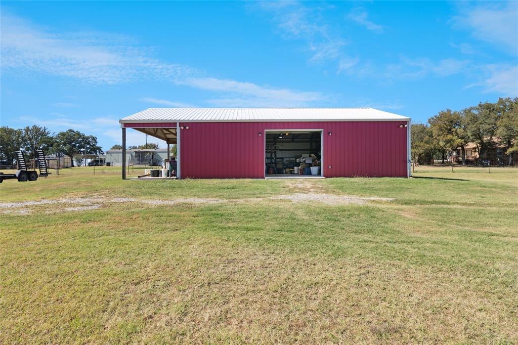3499 South Fm 113 Millsap, TX 76066 - Photo 32 of 36 a view of an empty room with a yard