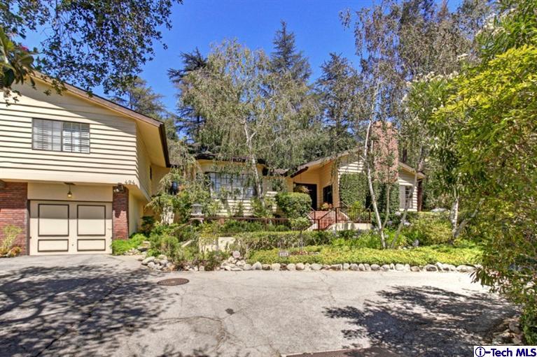 494 California Terrace Pasadena, CA 91105 - Photo 1 of 25 a front view of a house with a yard and a garage