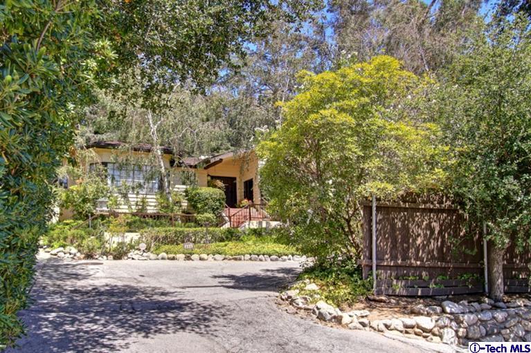 494 California Terrace Pasadena, CA 91105 - Photo 2 of 25 a front view of a house with a yard