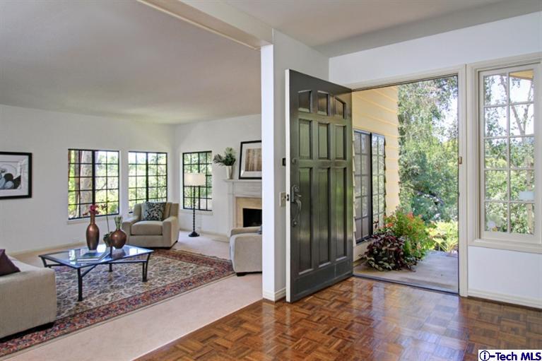 494 California Terrace Pasadena, CA 91105 - Photo 5 of 25 a living room with furniture large windows and wooden floor
