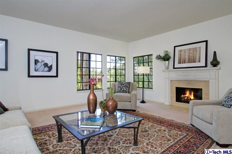 494 California Terrace Pasadena, CA 91105 - Photo 6 of 25 a living room with furniture a rug and a fireplace