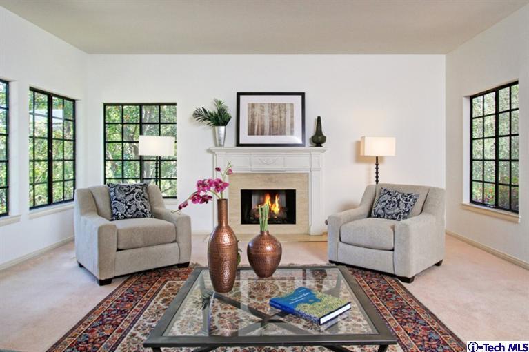 494 California Terrace Pasadena, CA 91105 - Photo 8 of 25 a living room with furniture a rug and a fireplace